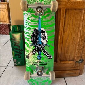 Powell Peralta Green Skateboard with Blue and Black Graphics